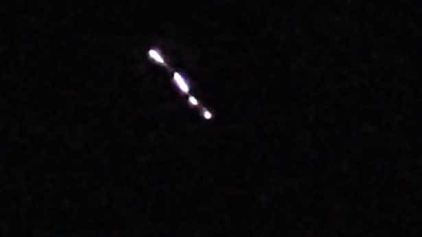 Men film glowing snake-like UFO in sky before chasing it down as it disappears