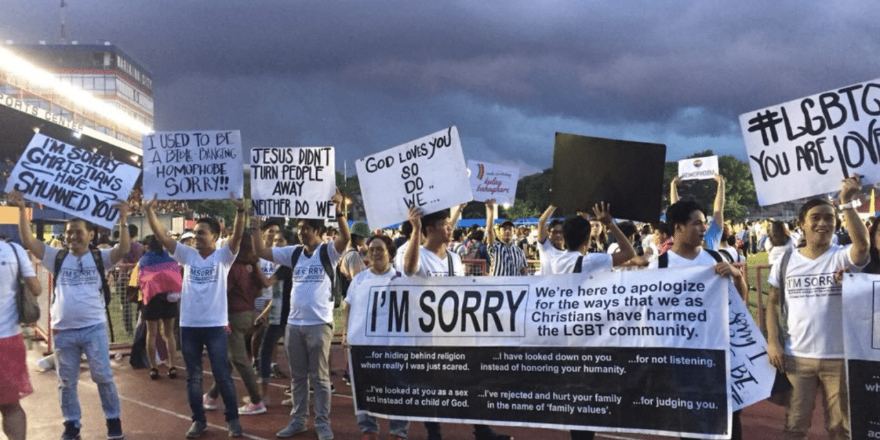 Christians surprise Pride parade marchers with signs apologizing for anti-LGBTQ views