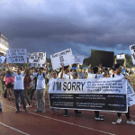 Christians surprise Pride parade marchers with signs apologizing for anti-LGBTQ views