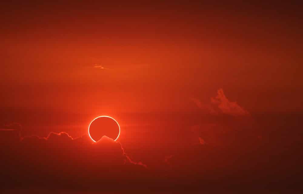 Incredible ‘red devil horns’ captured during rare solar eclipse mirage over the ocean