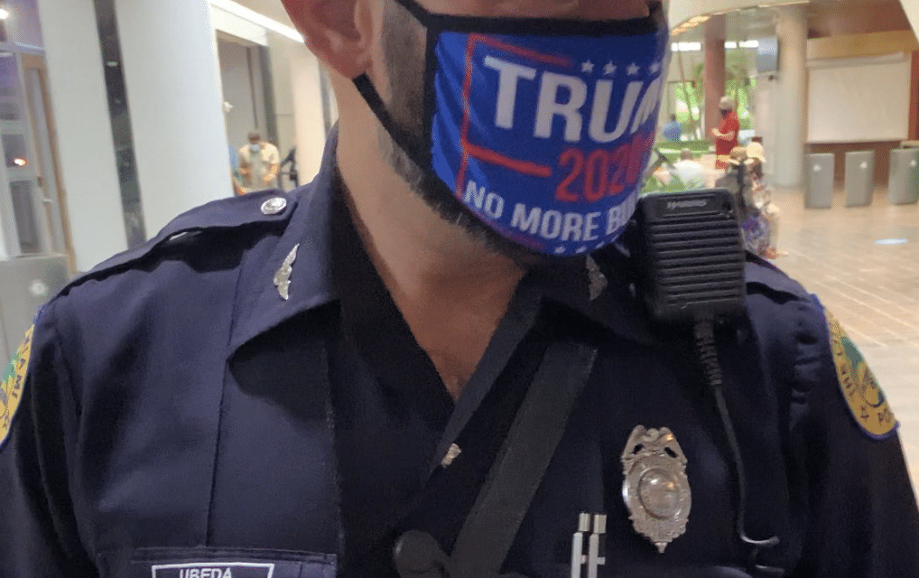Police officer facing suspension after pictures surfaced on social media, showing him wearing a Trump 2020 facial covering