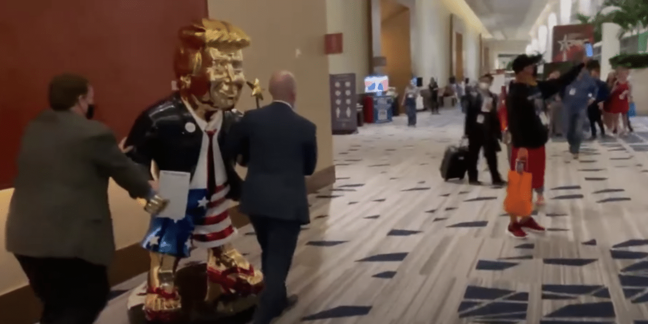 Massive golden statue of Trump holding star wand Wheeled Into Gathering ahead of speech