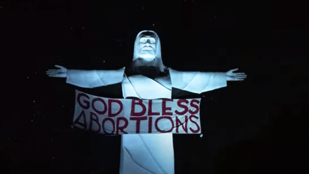 Activists Hang ‘God Bless Abortions’ Banner From Christ of the Ozarks Statue in Arkansas