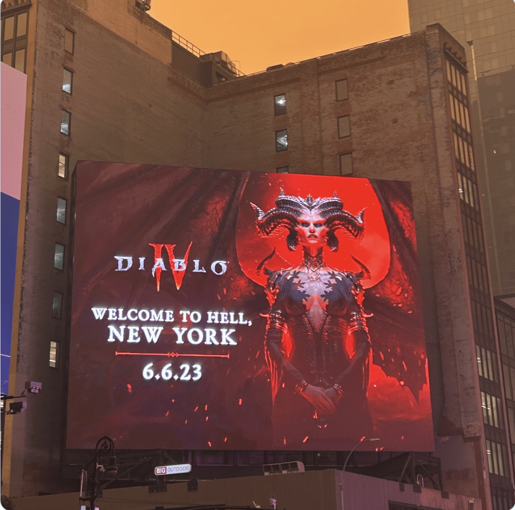 Demon “Lilith” on full display on billboard in Times Square with apocalyptic skies looming over New York