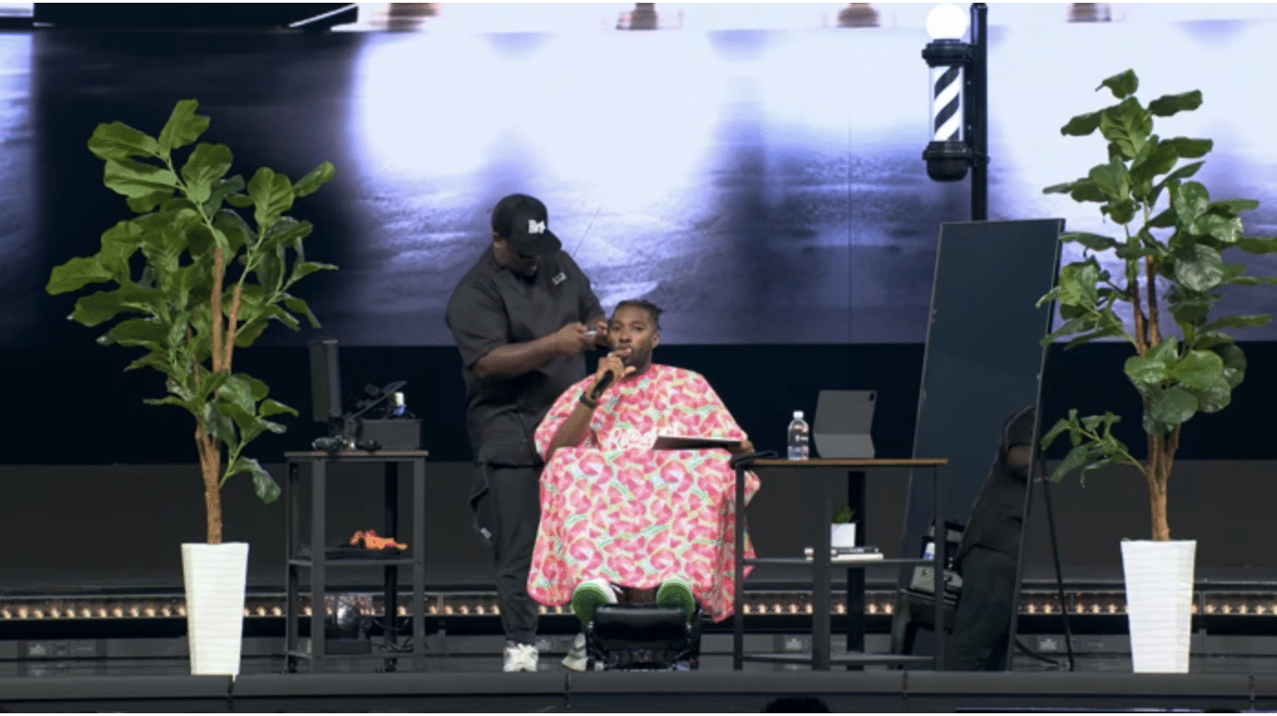 Megachurch pastor Michael Todd gets a haircut and a shave during his sermon