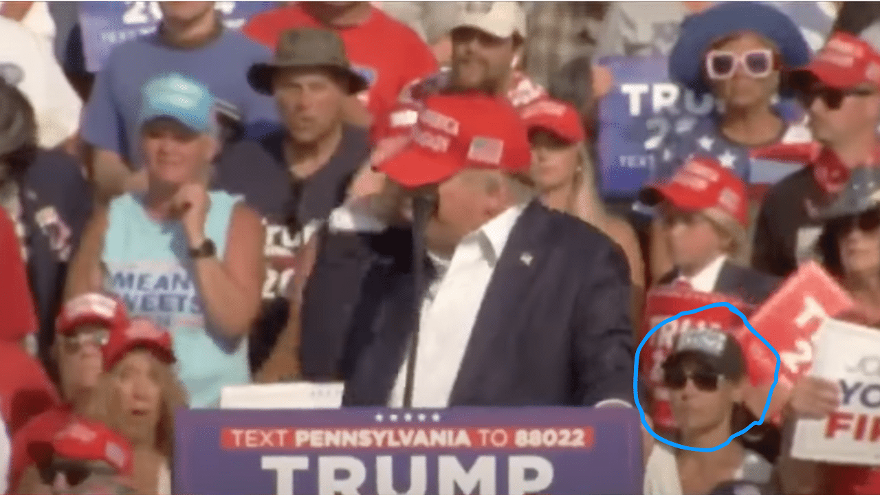 (WATCH) Woman sitting behind Trump during Pennsylvania assassination attempt goes viral for very strange behavior